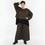 Jacquard Überwurf in schwarzcognacorange mit Kringelmuster oversized Rundhals Langarm