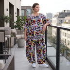 Kurzarmshirt aus fließender Viskose in zartem Lila mit femininem Stufenschnitt im Sommer