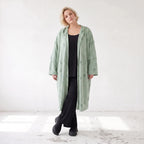 Cardigan in Pistaziengrün mit Kapuze aus weichem Jersey gerade geschnitten offen tragbar