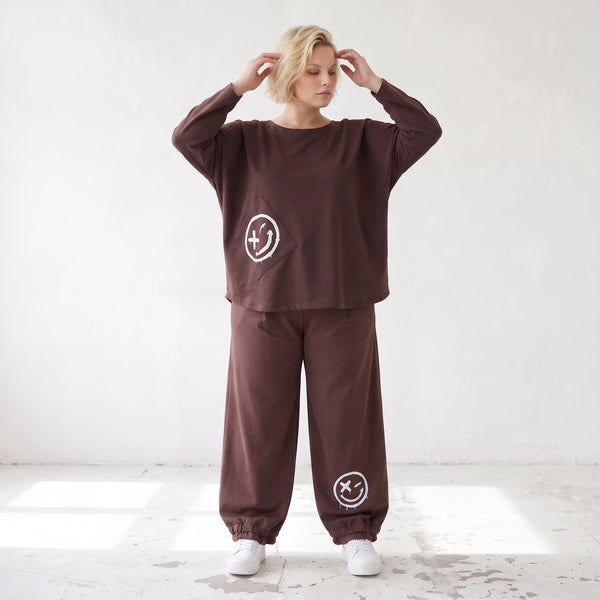Lässige Oversizedhose aus French Terry mit Smileyprint und gesmoktem Saum extra lang
