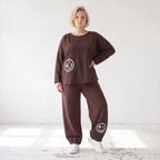 Lässige Oversizedhose aus French Terry mit Smileyprint und gesmoktem Saum extra lang