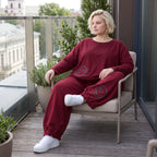Oversized French Terry Hose in Schwarz mit Smileyprint gesmoktem Saum und weitem Bein