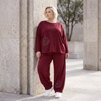 Oversized French Terry Hose in Schwarz mit Smileyprint gesmoktem Saum und weitem Bein