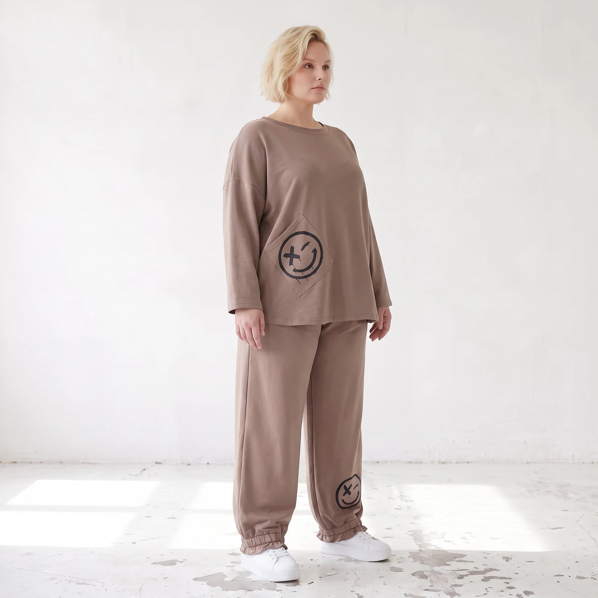 French-Terry Oversizedhose mit Smiley-Print gesmoktem Saum und Seitentaschen Streetstyle