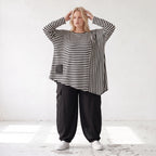 Langarmshirt in Schwarz/Weiß aus weichem Stretchjersey mit asymmetrischem Zipfelsaum