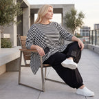 Langarmshirt in Schwarz/Weiß aus weichem Stretchjersey mit asymmetrischem Zipfelsaum
