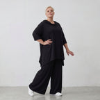 Fließendes Shirt in Schwarz mit Zipfelkapuze und Dreiviertelarm aus weichem Viskosejersey