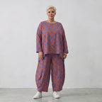 Kastiges Bigshirt in Lila Orange mit Blumendruck Leinenoptik und längerem Rückenteil